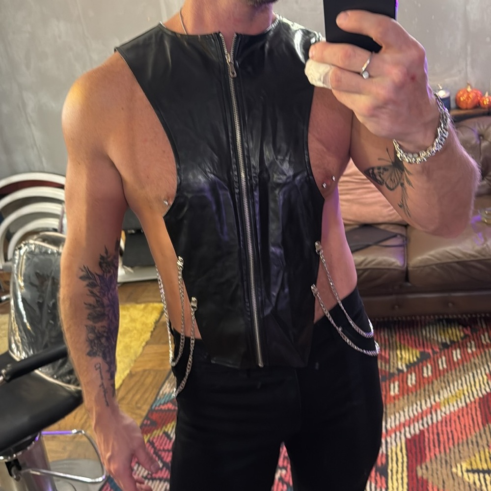 Men’s incredibly unique, faux leather top with chains and zipper detail